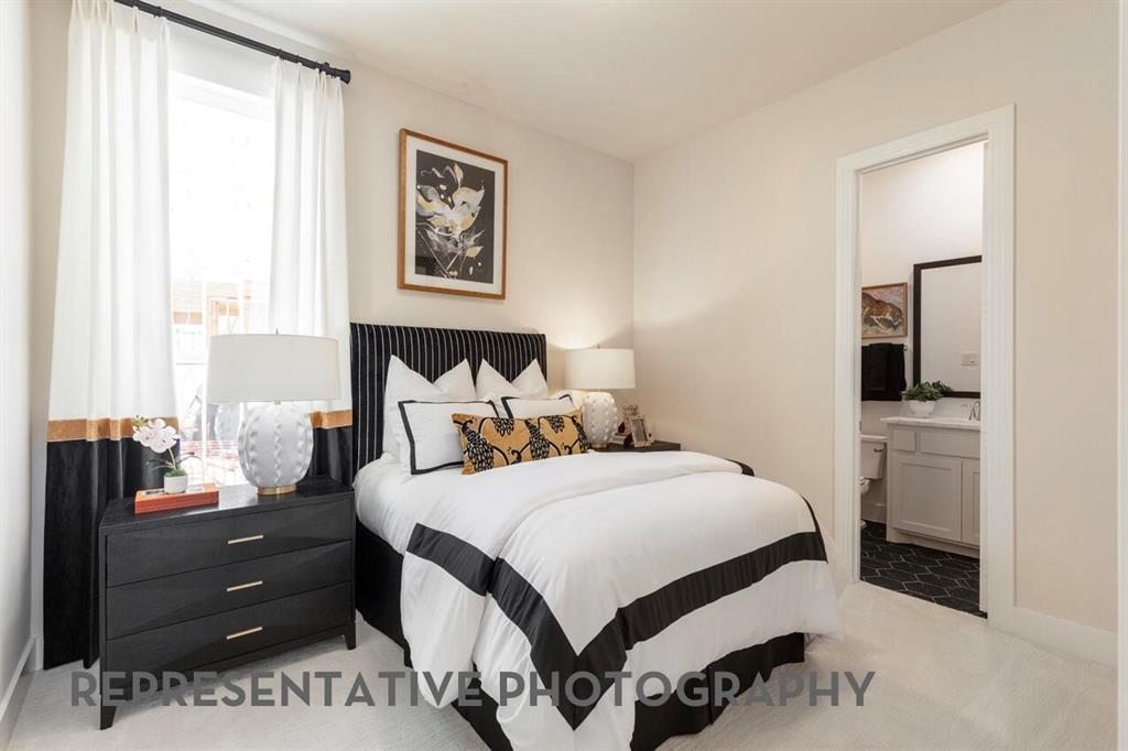 4415 Azalea Trail Oak Point, TX 75068 - Photo 18 of 38 a bedroom with a bed and a cabinets