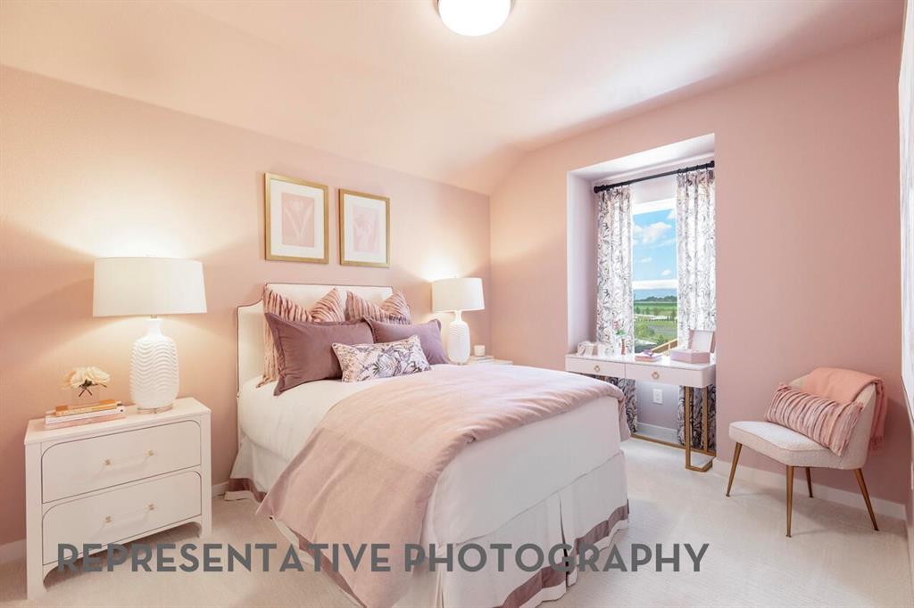 4415 Azalea Trail Oak Point, TX 75068 - Photo 20 of 38 a bedroom with a bed and a chair