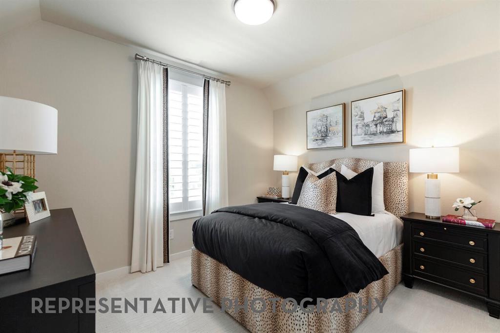 4415 Azalea Trail Oak Point, TX 75068 - Photo 21 of 38 a bedroom with a bed and a night stand