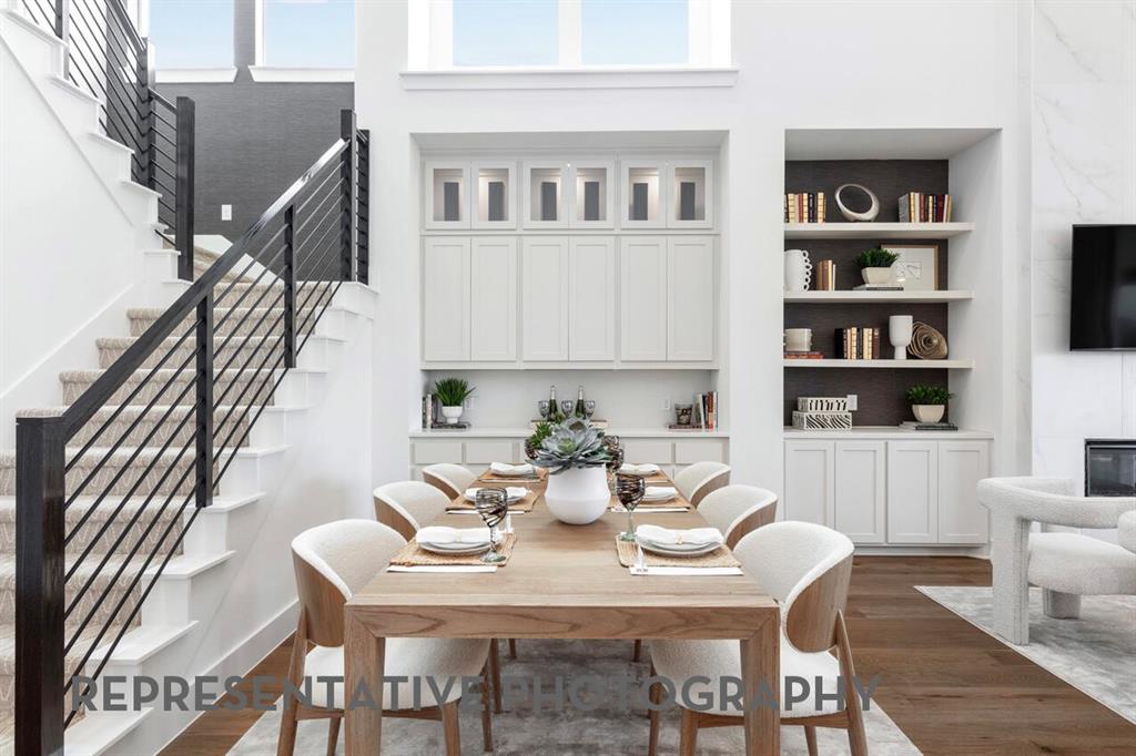 4415 Azalea Trail Oak Point, TX 75068 - Photo 23 of 38 a view of a dining room with furniture and a potted plant