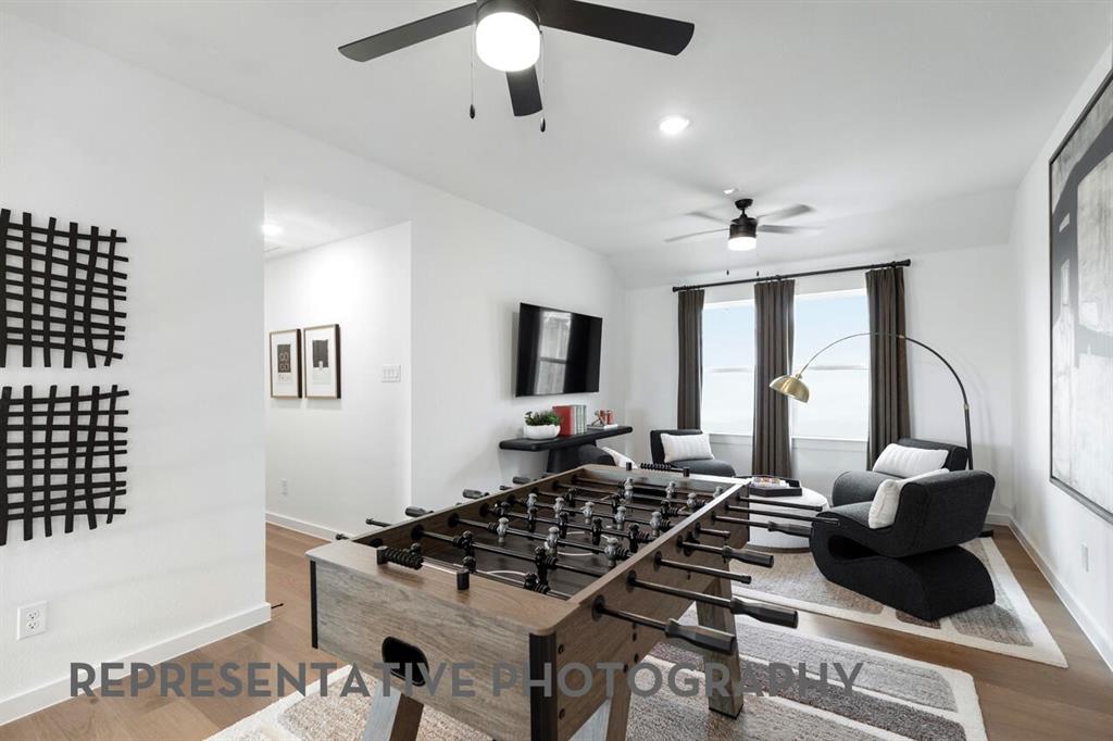 4415 Azalea Trail Oak Point, TX 75068 - Photo 27 of 38 a living room with furniture and a flat screen tv