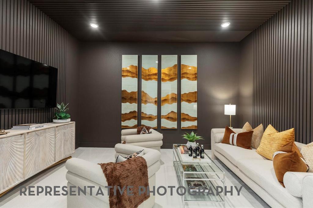 4415 Azalea Trail Oak Point, TX 75068 - Photo 29 of 38 a living room with furniture a flat screen tv and a fireplace