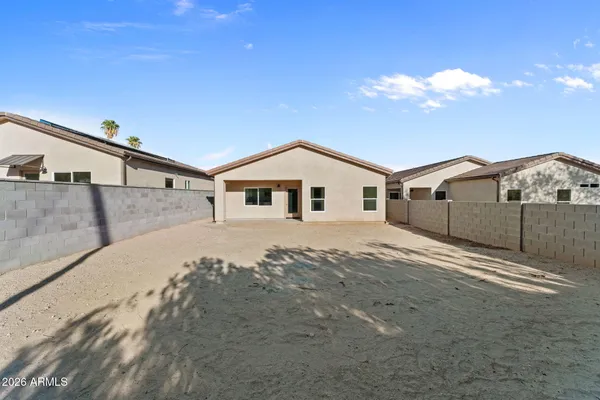 a view of a house with a backyard