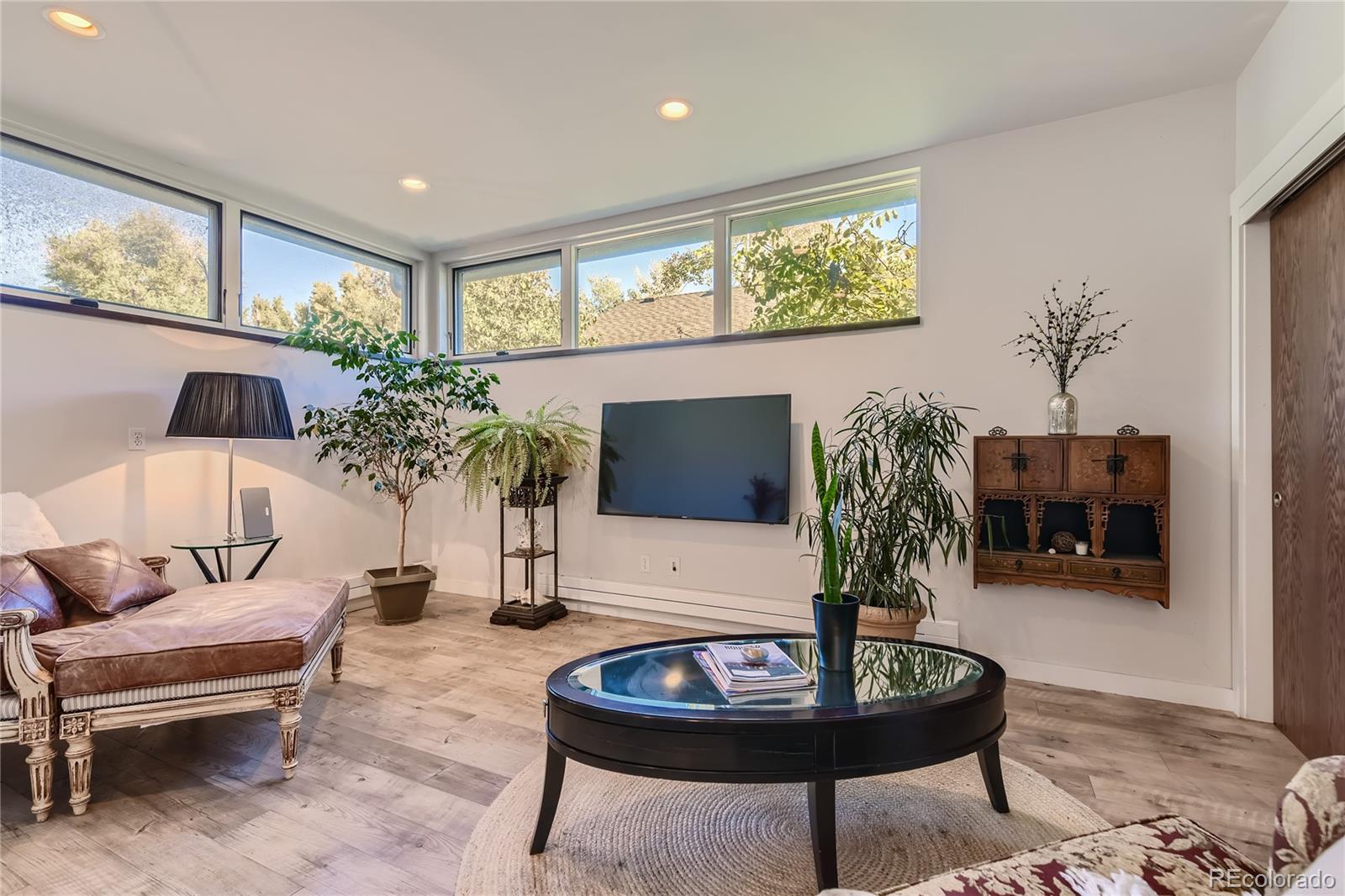 161 3rd Avenue Niwot, CO 80544 - Photo 13 of 41 a living room with furniture and a potted plant