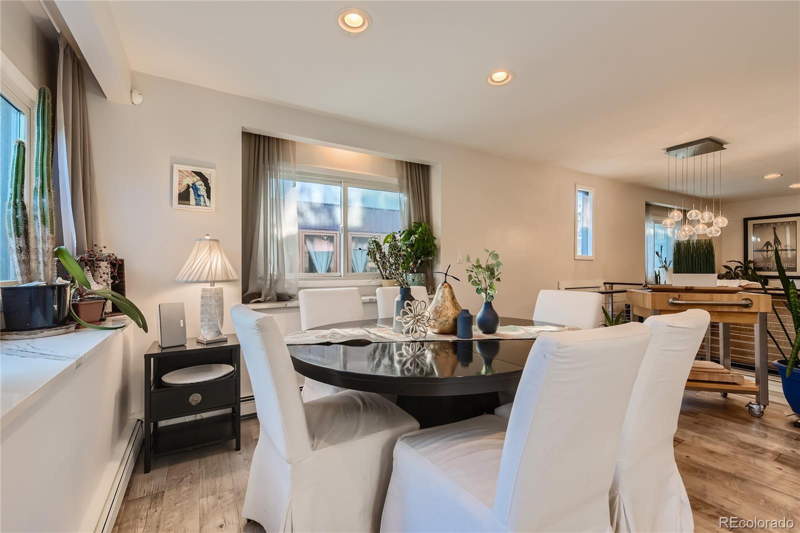 161 3rd Avenue Niwot, CO 80544 - Photo 14 of 41 a view of a dining room with furniture and wooden floor