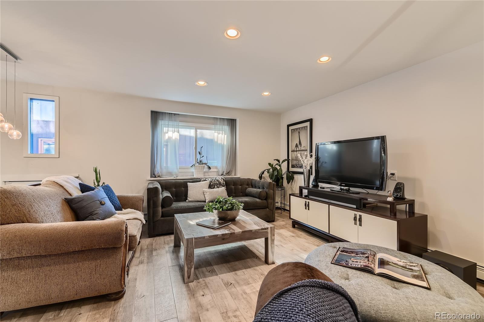 161 3rd Avenue Niwot, CO 80544 - Photo 16 of 41 a living room with furniture and a flat screen tv