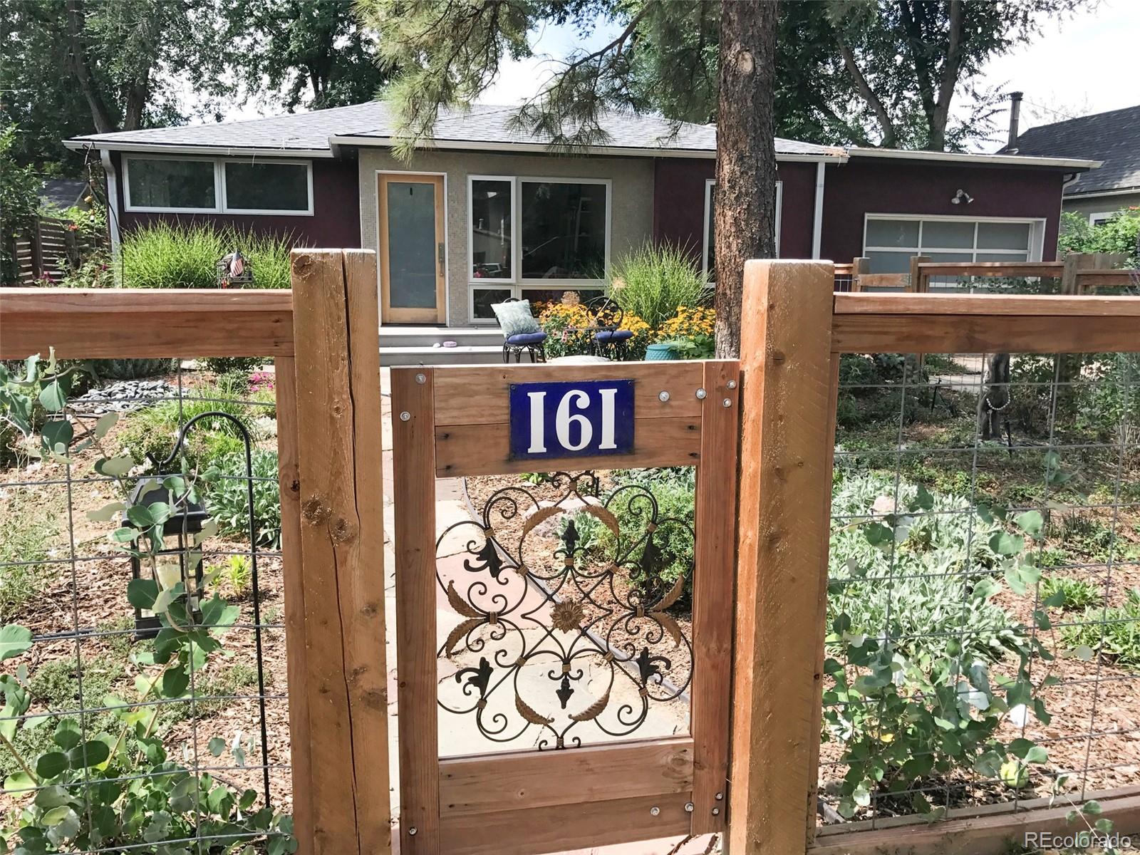 161 3rd Avenue Niwot, CO 80544 - Photo 2 of 41 a front view of a house with garden