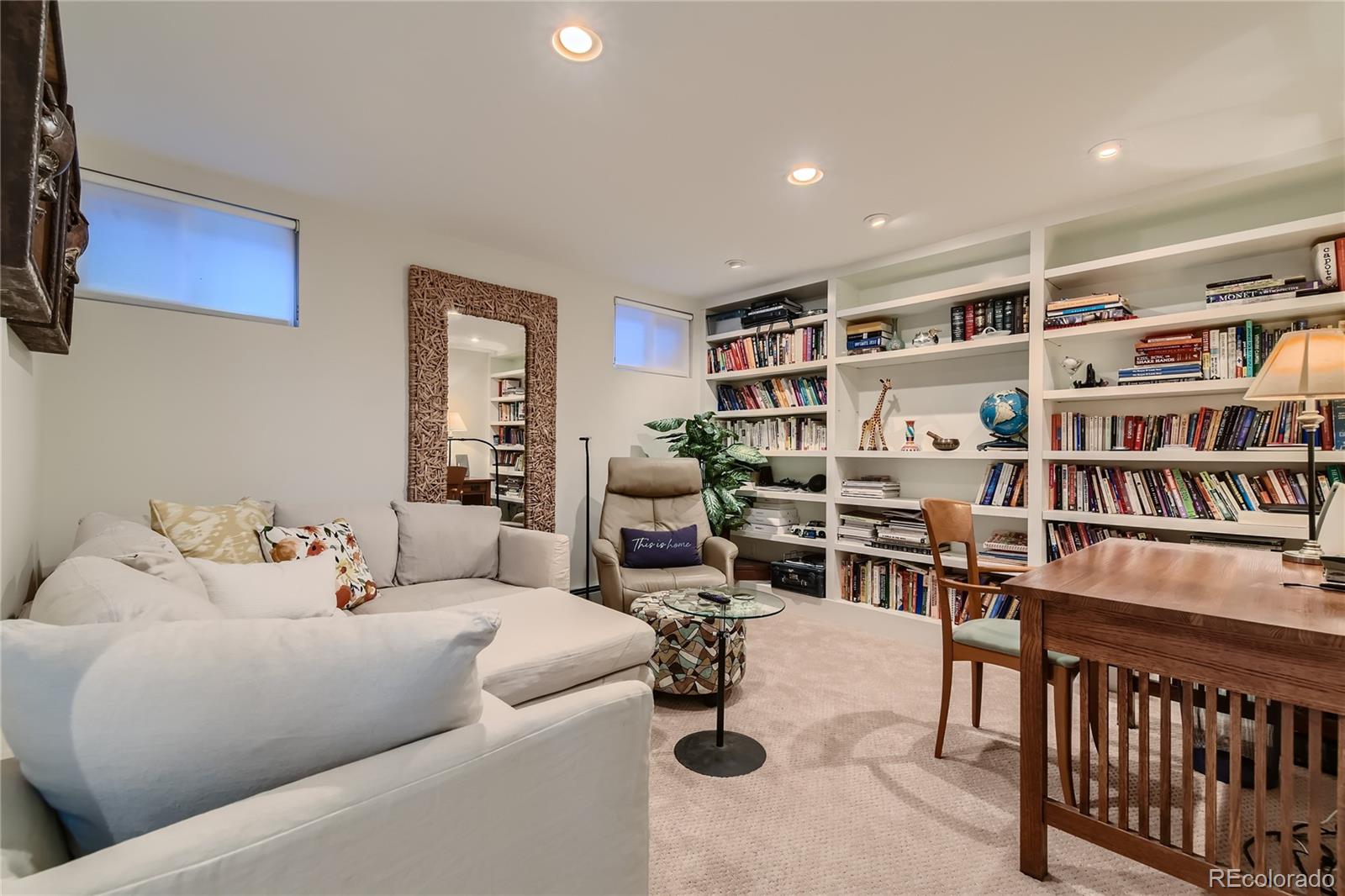 161 3rd Avenue Niwot, CO 80544 - Photo 22 of 41 a living room with furniture and a book shelf