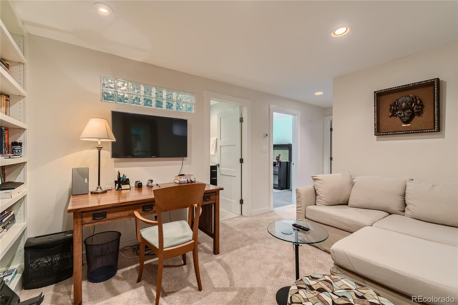 161 3rd Avenue Niwot, CO 80544 - Photo 23 of 41 a living room with furniture and a flat screen tv