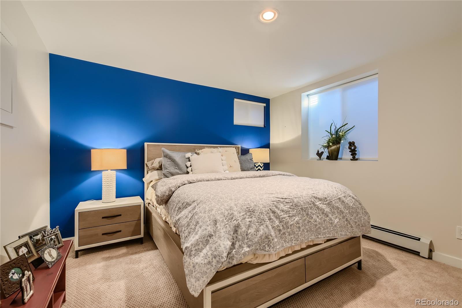 161 3rd Avenue Niwot, CO 80544 - Photo 24 of 41 a bedroom with a bed and a couch