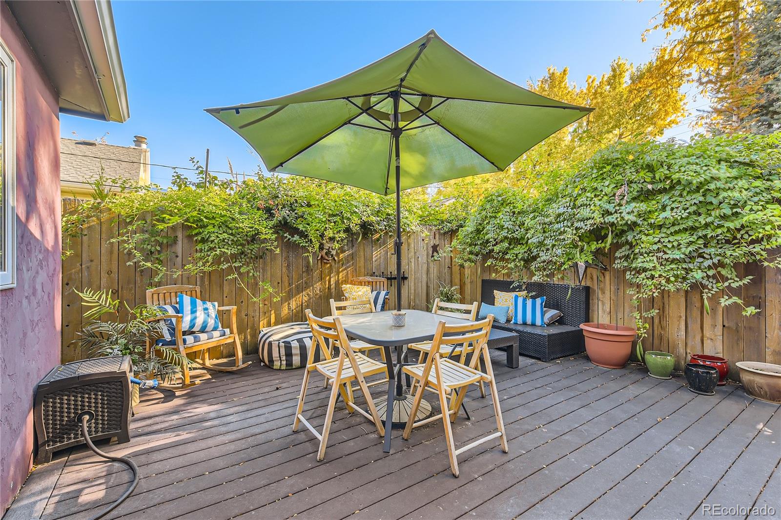 161 3rd Avenue Niwot, CO 80544 - Photo 27 of 41 an outdoor space with furniture and umbrella