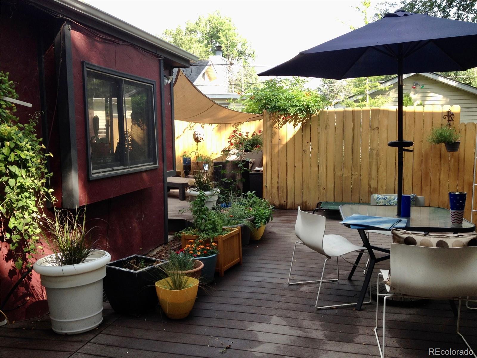 161 3rd Avenue Niwot, CO 80544 - Photo 28 of 41 a view of a patio with chairs and potted plants
