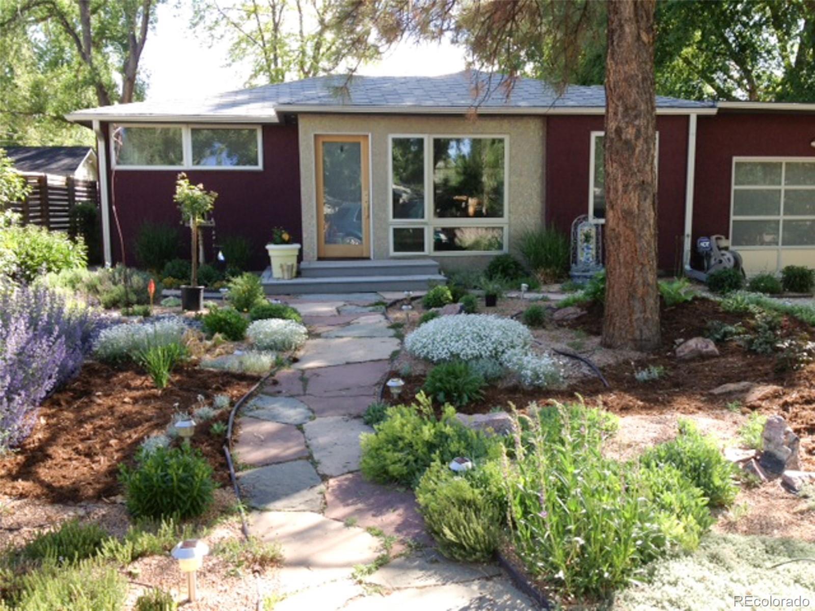 161 3rd Avenue Niwot, CO 80544 - Photo 3 of 41 a front view of a house with garden