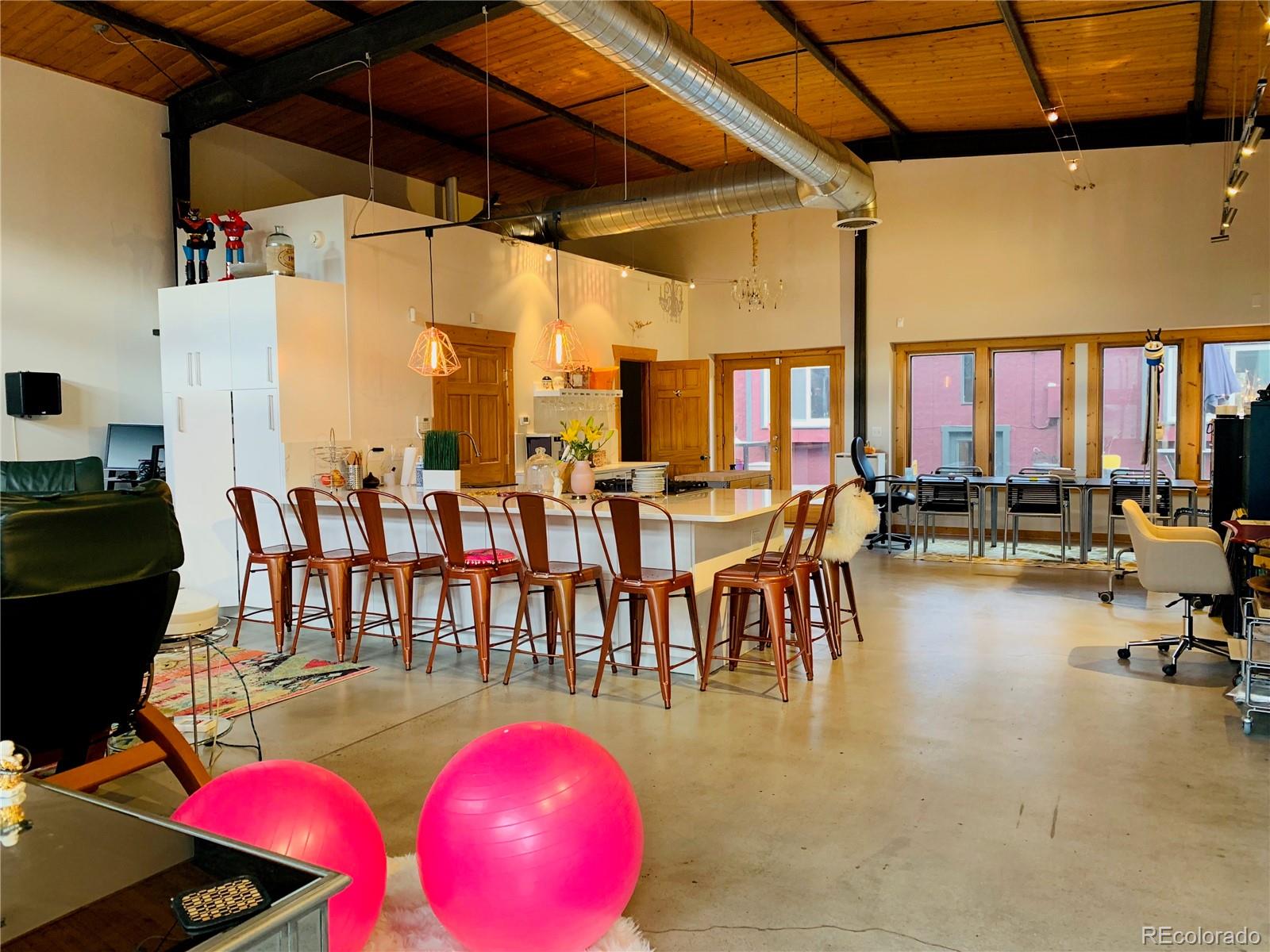 161 3rd Avenue Niwot, CO 80544 - Photo 35 of 41 a dining hall with furniture and a floor to ceiling window