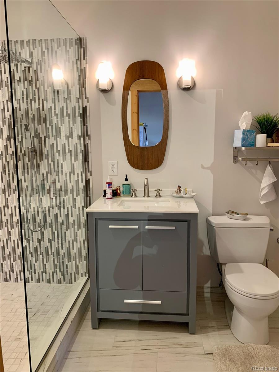 161 3rd Avenue Niwot, CO 80544 - Photo 38 of 41 a bathroom with a sink mirror and toilet