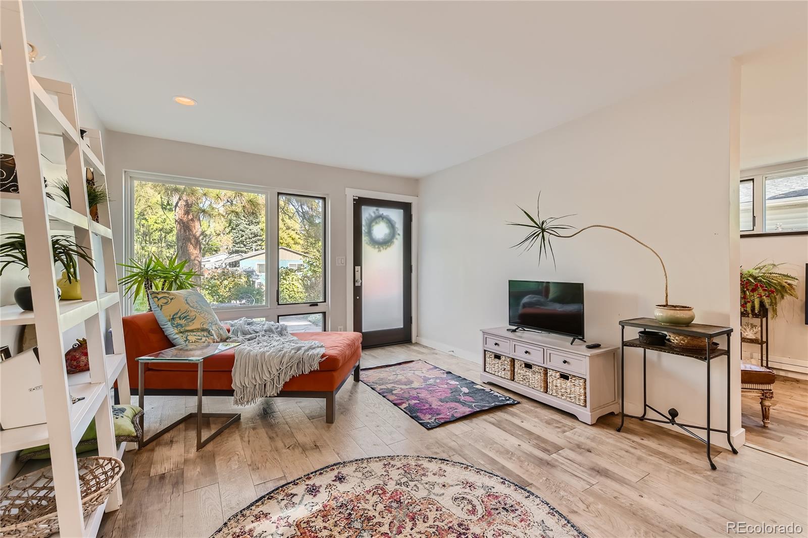 161 3rd Avenue Niwot, CO 80544 - Photo 7 of 41 a bedroom with furniture and a flat screen tv
