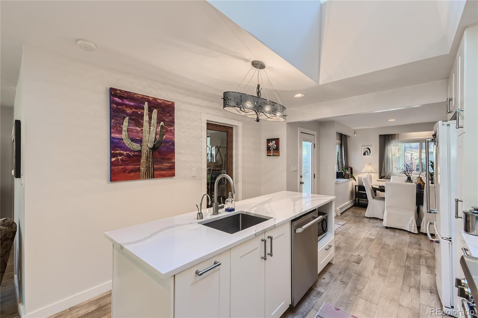 161 3rd Avenue Niwot, CO 80544 - Photo 9 of 41 a kitchen with a sink stove and cabinets