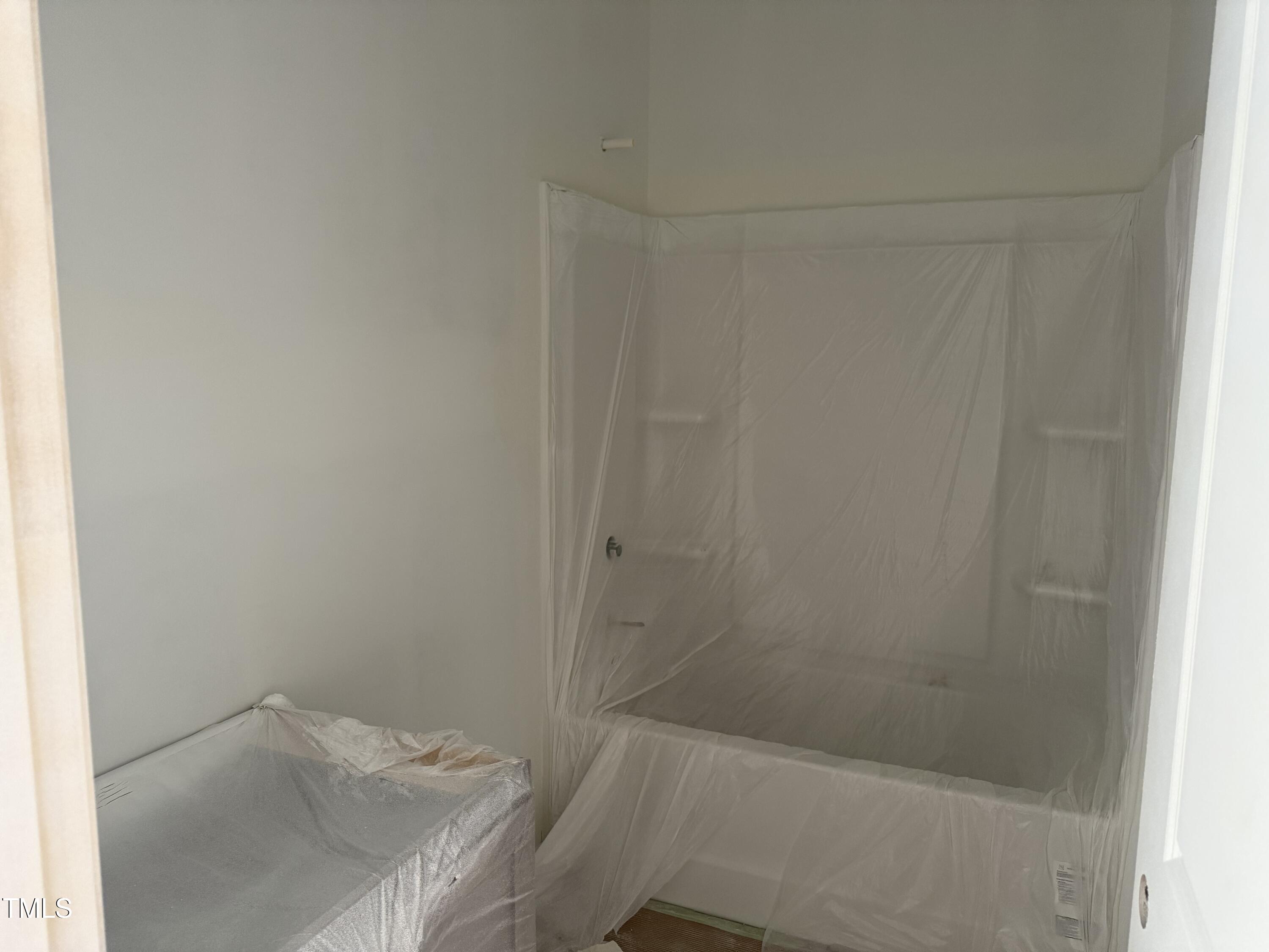 11751 Salers Loop Middlesex, NC 27557 - Photo 14 of 30 a bathroom with a sink and shower