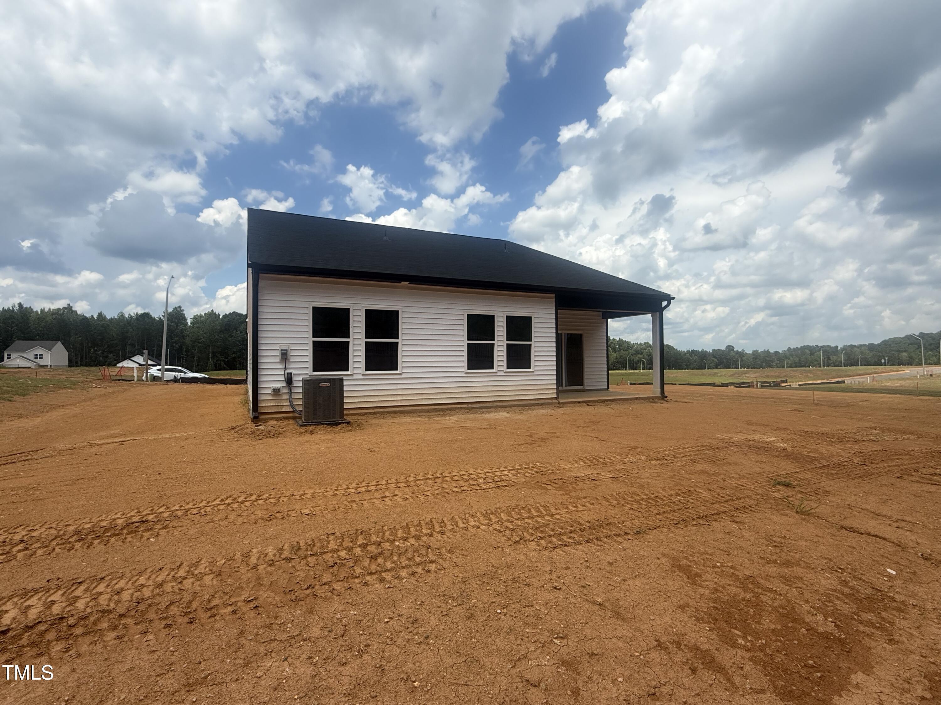 11751 Salers Loop Middlesex, NC 27557 - Photo 20 of 30 a view of a house with backyard and sitting area