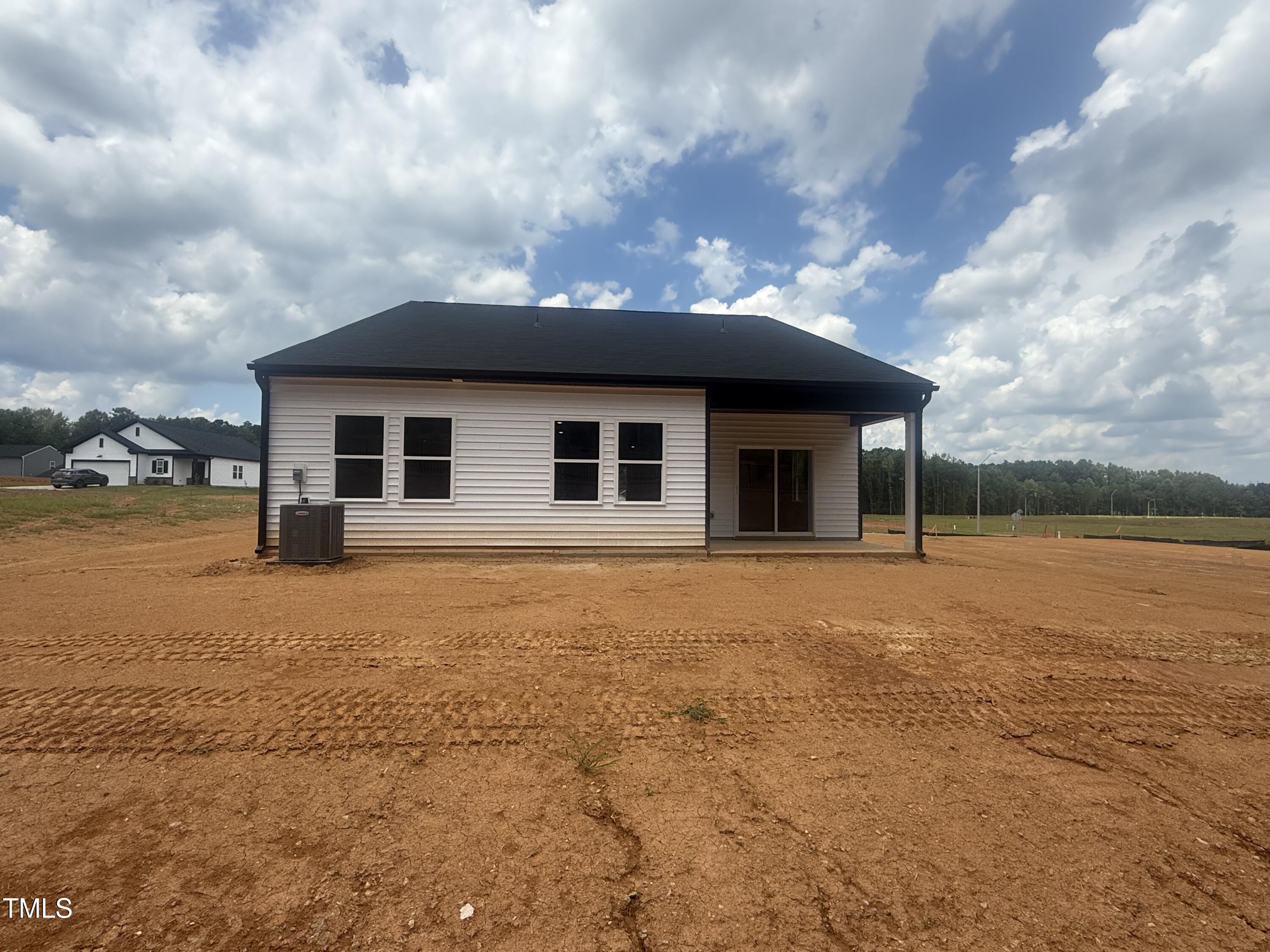 11751 Salers Loop Middlesex, NC 27557 - Photo 21 of 30 a backyard of a house with yard and barbeque oven