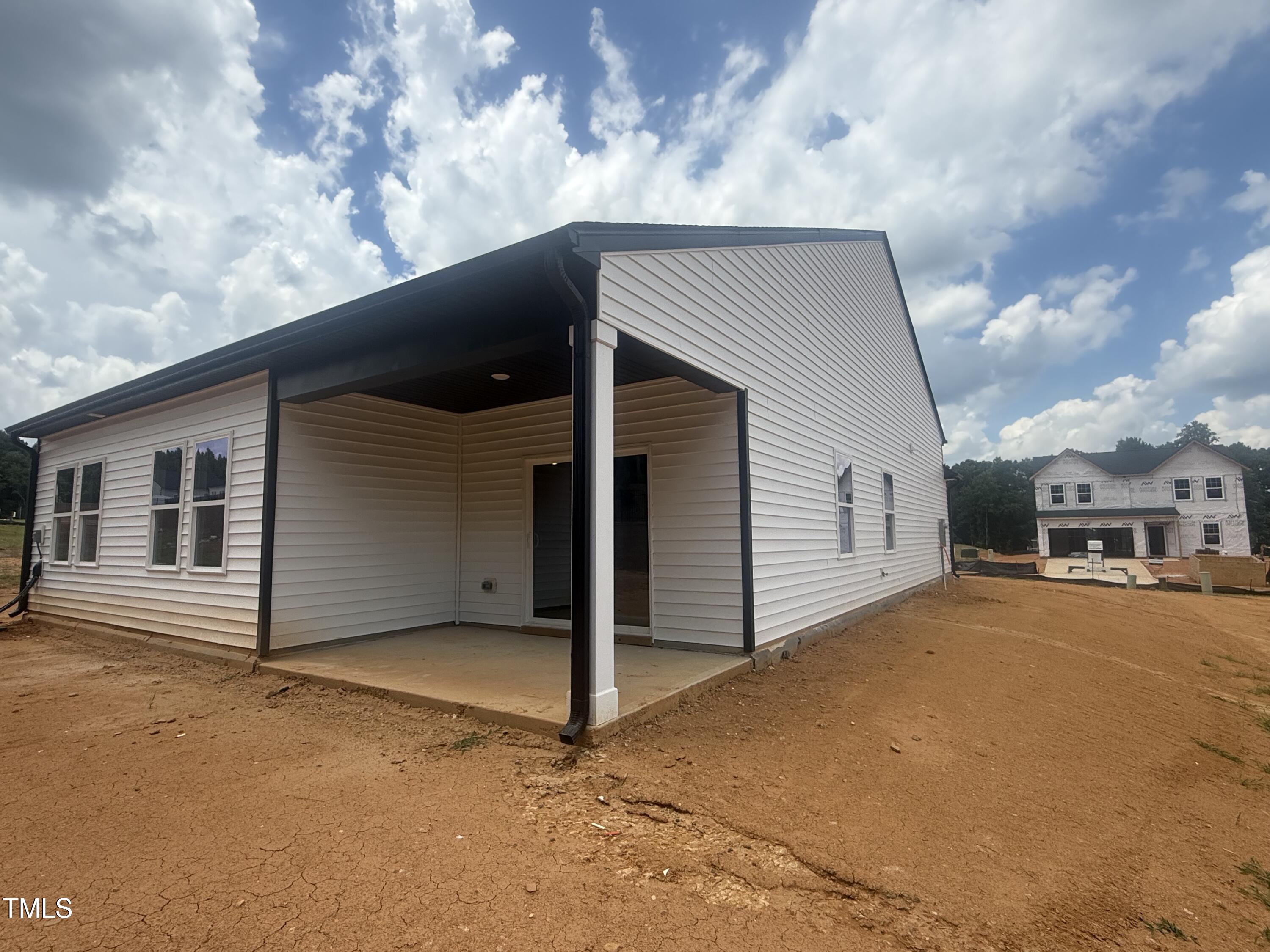 11751 Salers Loop Middlesex, NC 27557 - Photo 22 of 30 a backyard of a house with garage