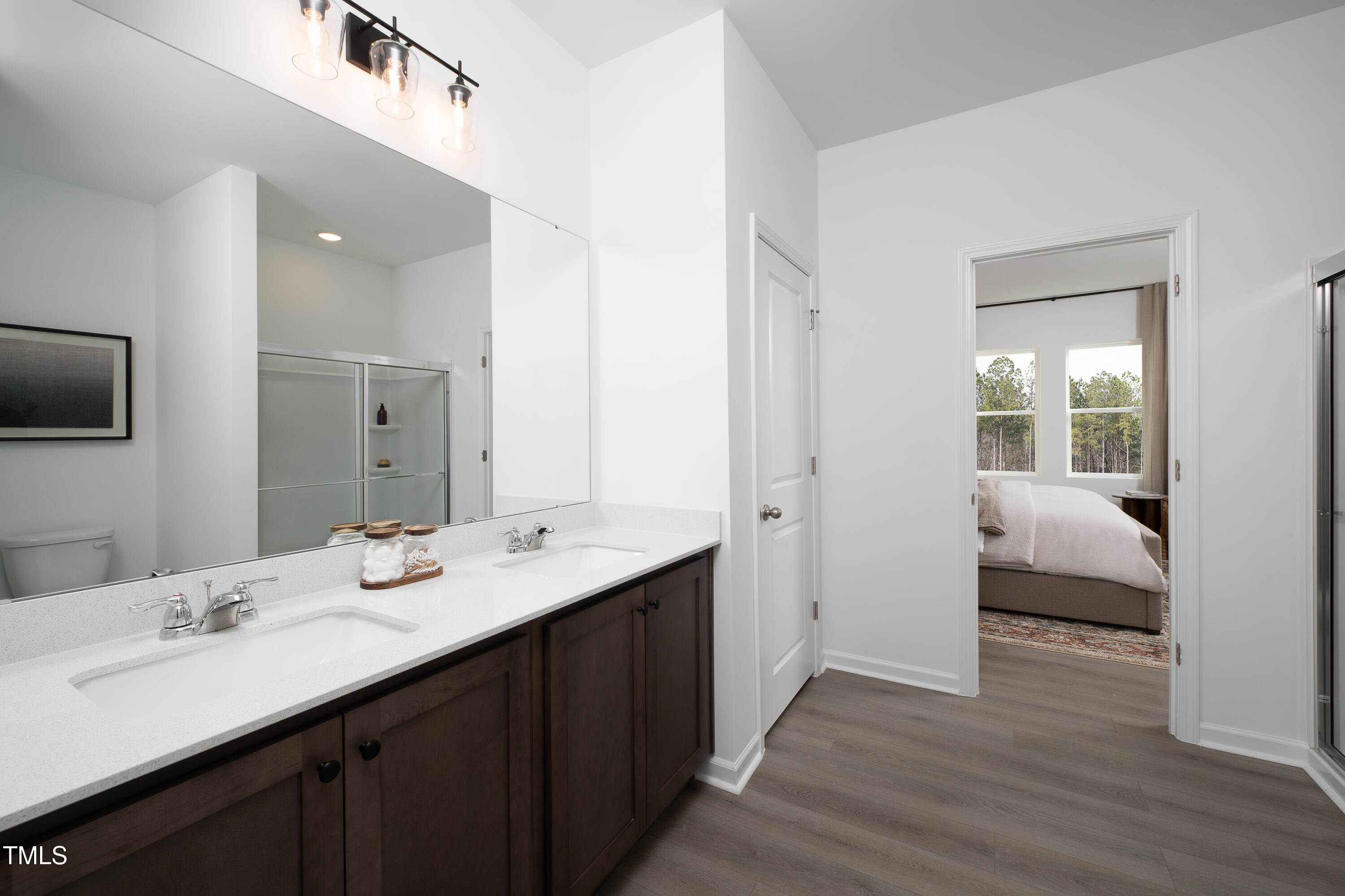11751 Salers Loop Middlesex, NC 27557 - Photo 9 of 30 a en suite bathroom with a double vanity sink and a mirror