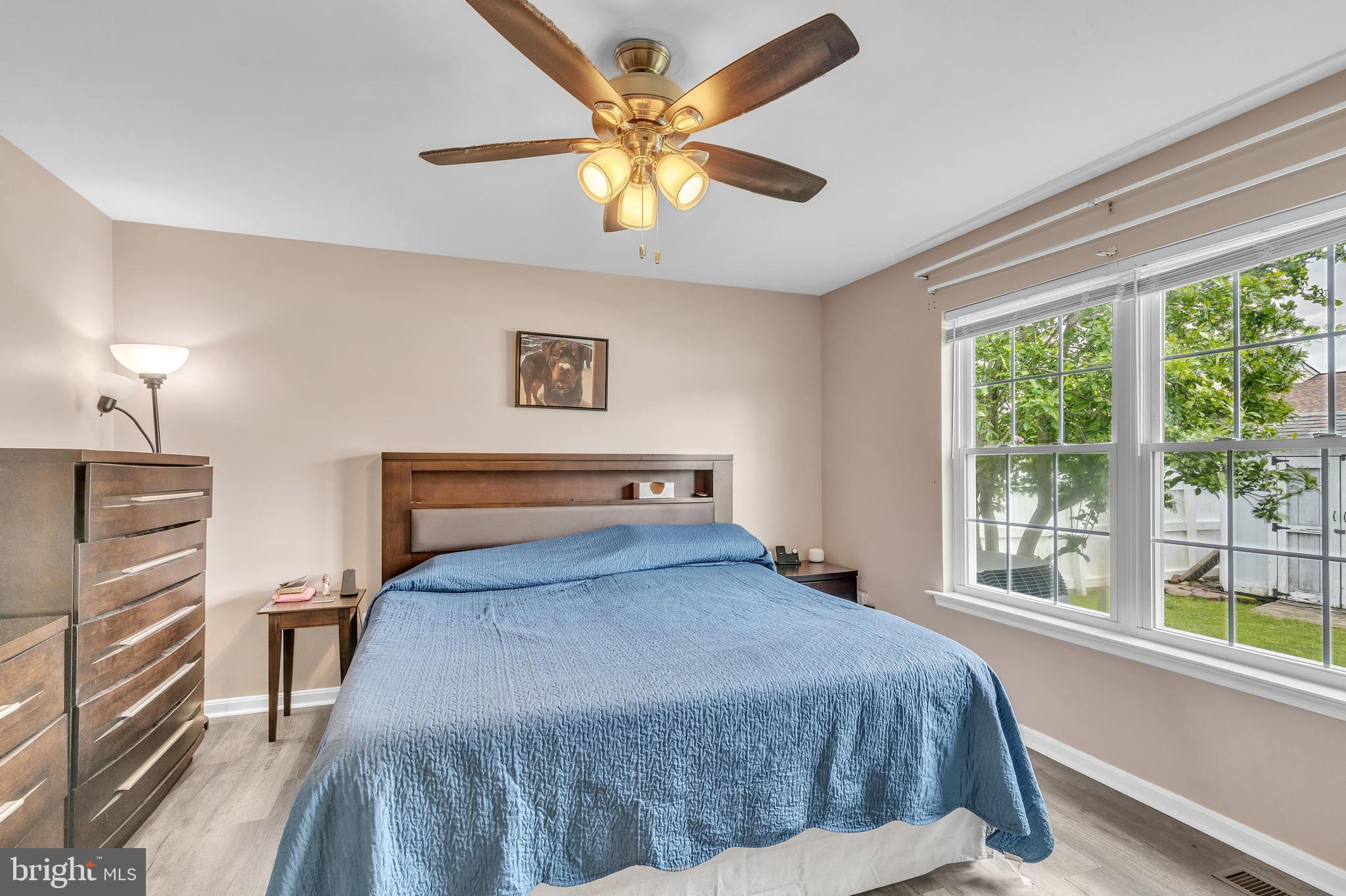5 Patricia Circle Bear, DE 19701 - Photo 11 of 23 a bedroom with a bed and a large window with a flat tv screen