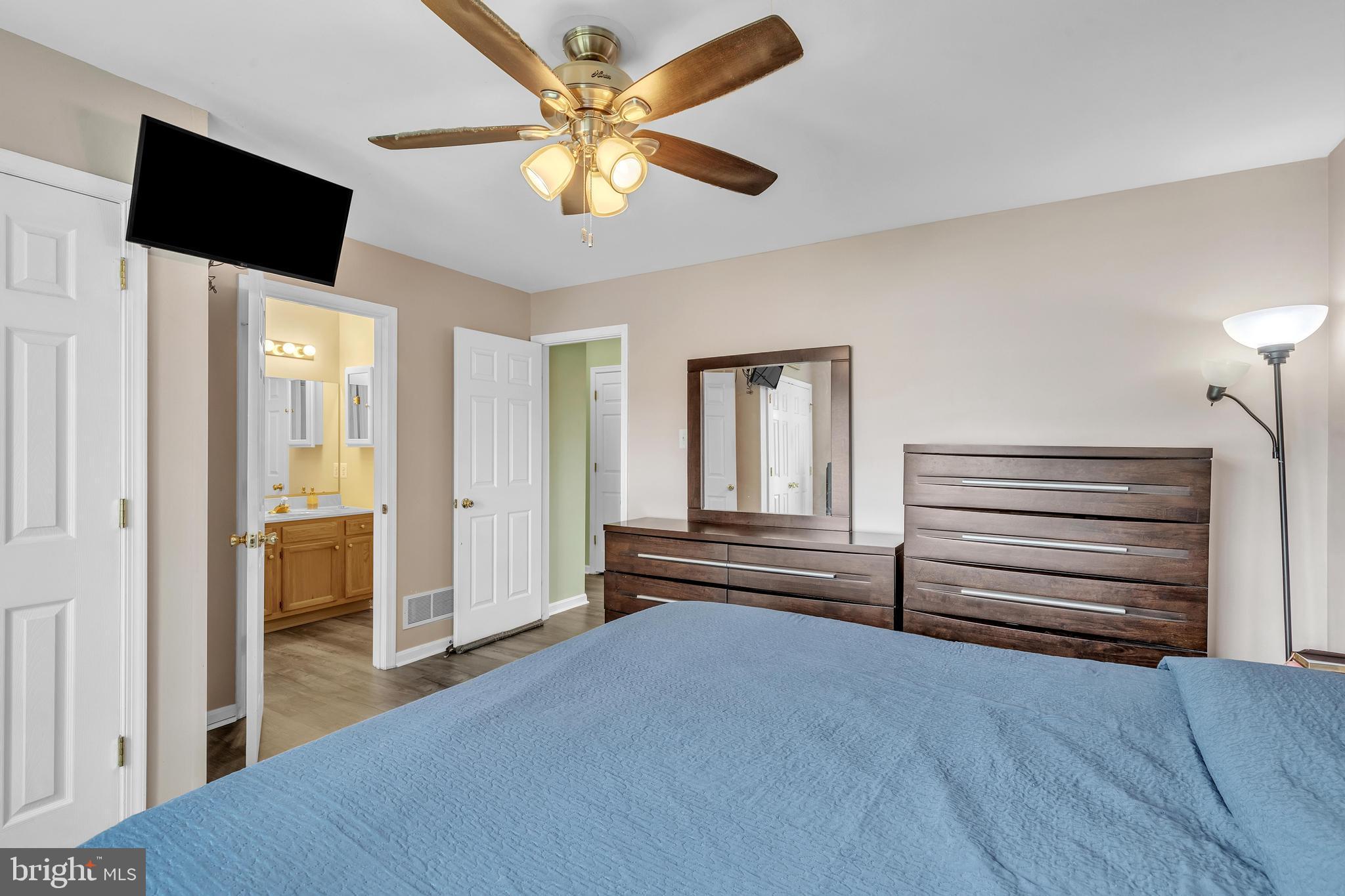 5 Patricia Circle Bear, DE 19701 - Photo 12 of 23 a view of a livingroom with wooden floor and a ceiling fan