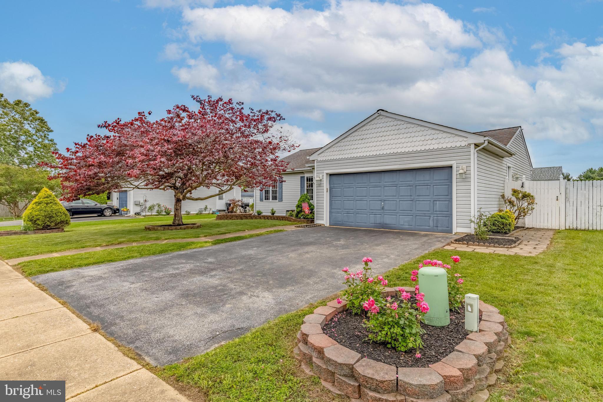 5 Patricia Circle Bear, DE 19701 - Photo 2 of 23 a front view of a house with a yard and garage