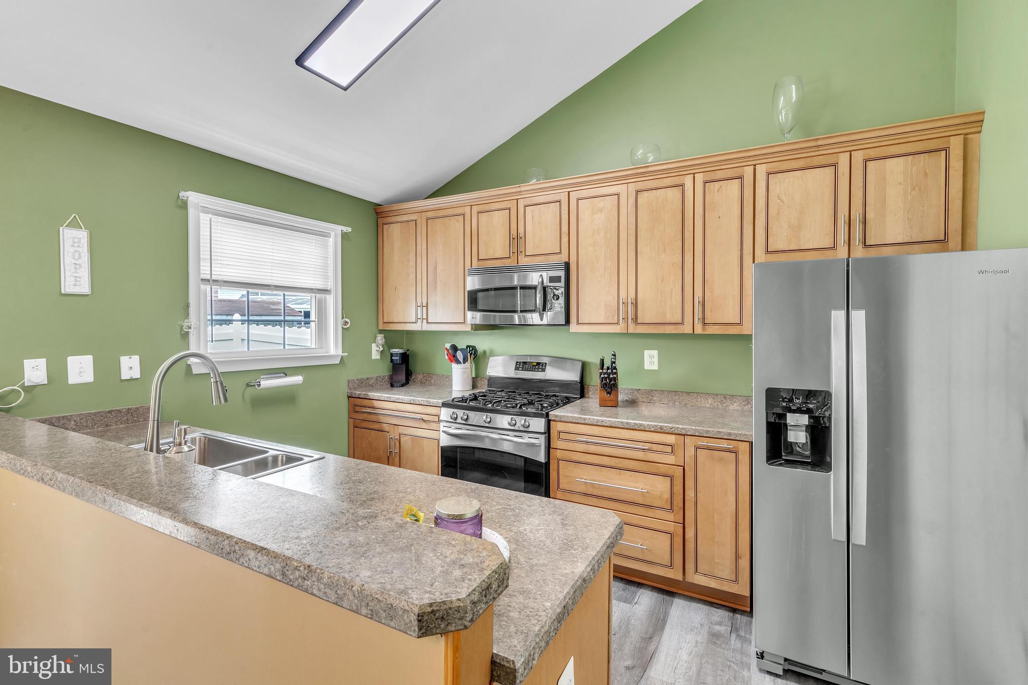 5 Patricia Circle Bear, DE 19701 - Photo 7 of 23 a kitchen with granite countertop a refrigerator stove top oven and sink