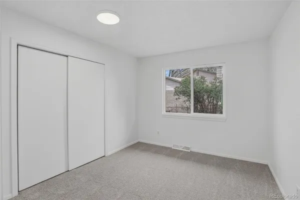 a view of a room that has a window in it