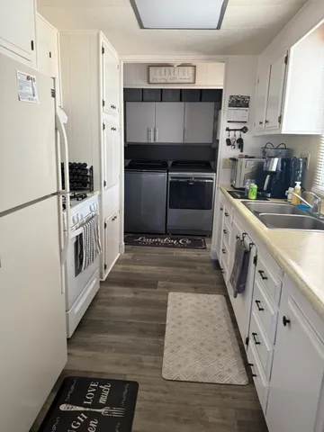 a kitchen with granite countertop a refrigerator and a stove