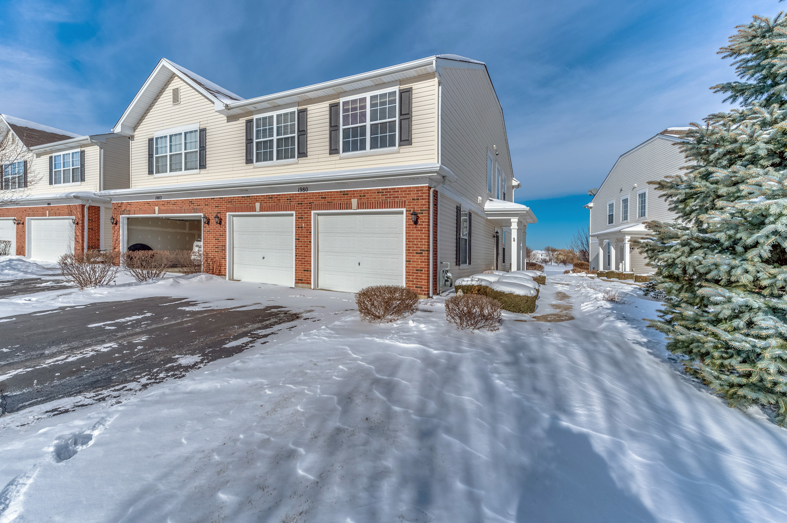 1980 West Cobblestone Road Romeoville, IL 60446 - Photo 1 of 1 a front view of a house with a yard