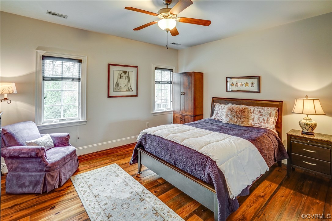 700 Old Stream Road Manakin-Sabot, VA 23103 - Photo 31 of 50 a bedroom with a bed and wooden floor
