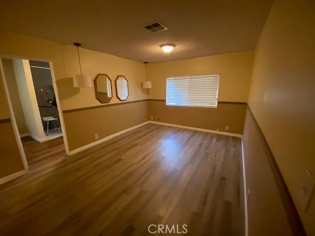a view of a garage with wooden floor
