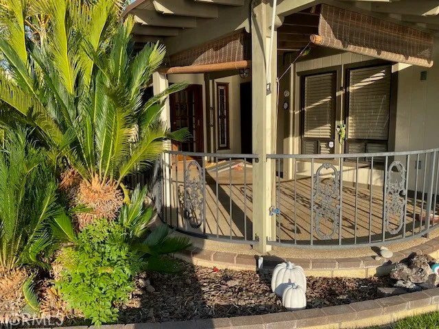 a view of a terrace with a garden and seating area