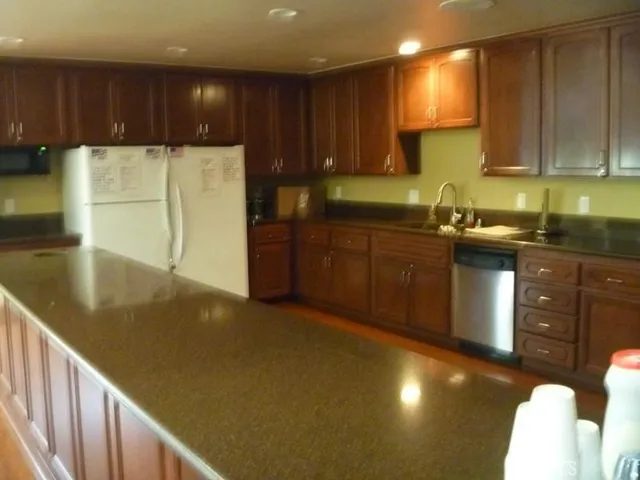 a living room with lots of furniture and a large window