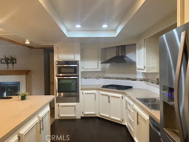 a kitchen with a sink stove and refrigerator