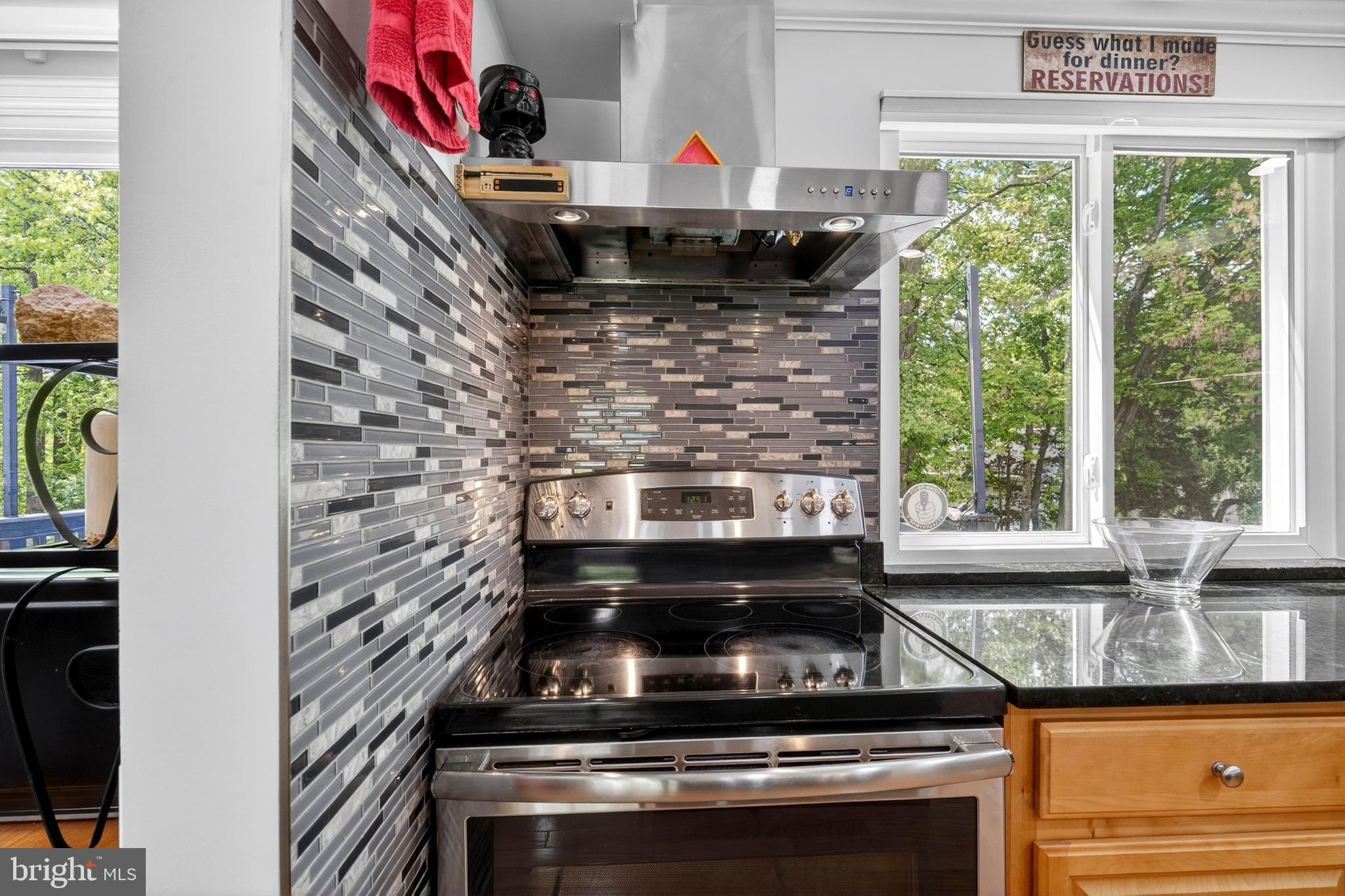 8373 Magic Leaf Road Springfield, VA 22153 - Photo 27 of 69 a stove top oven sitting inside of a kitchen