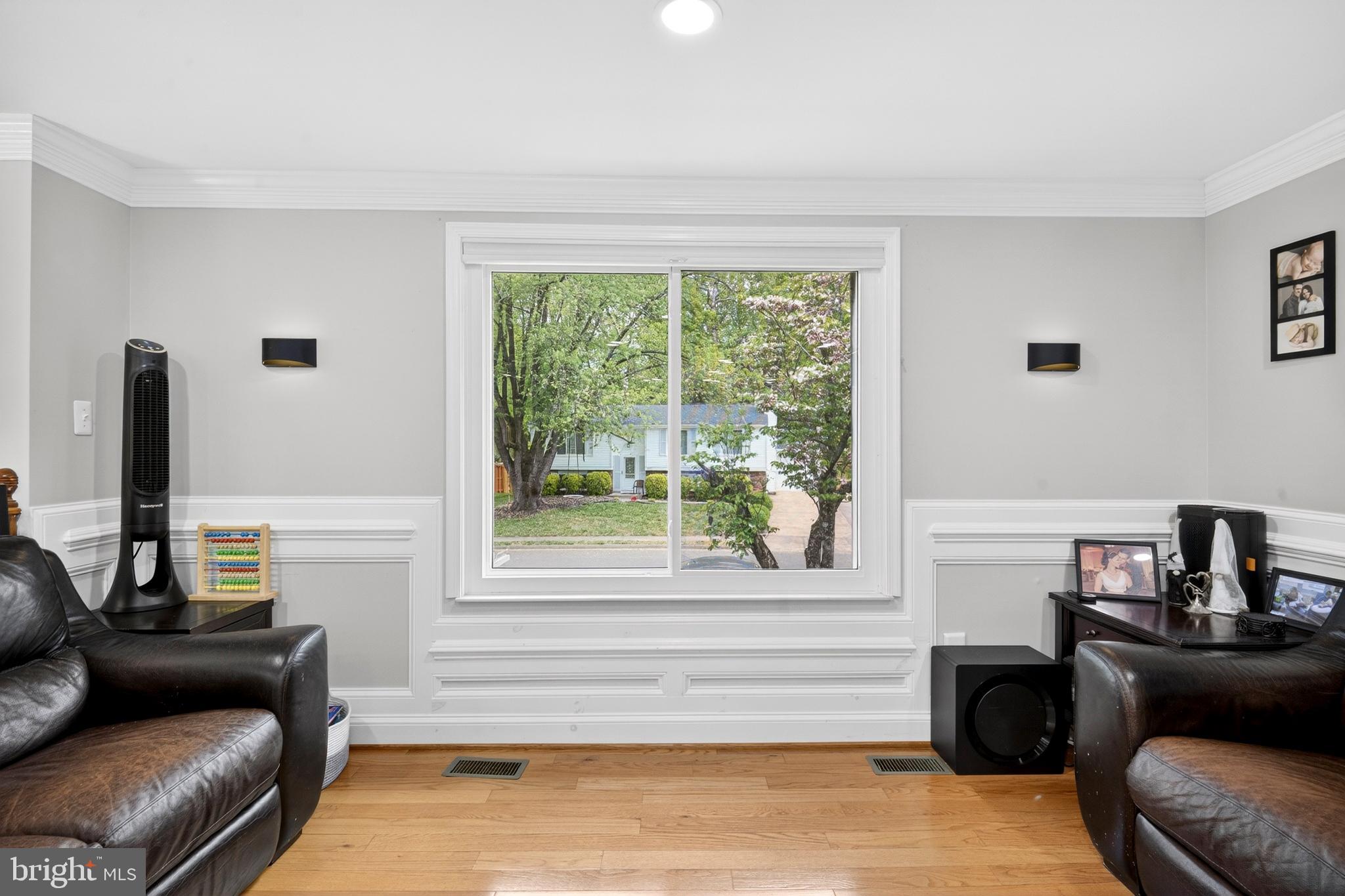 8373 Magic Leaf Road Springfield, VA 22153 - Photo 29 of 69 a living room with furniture and a window