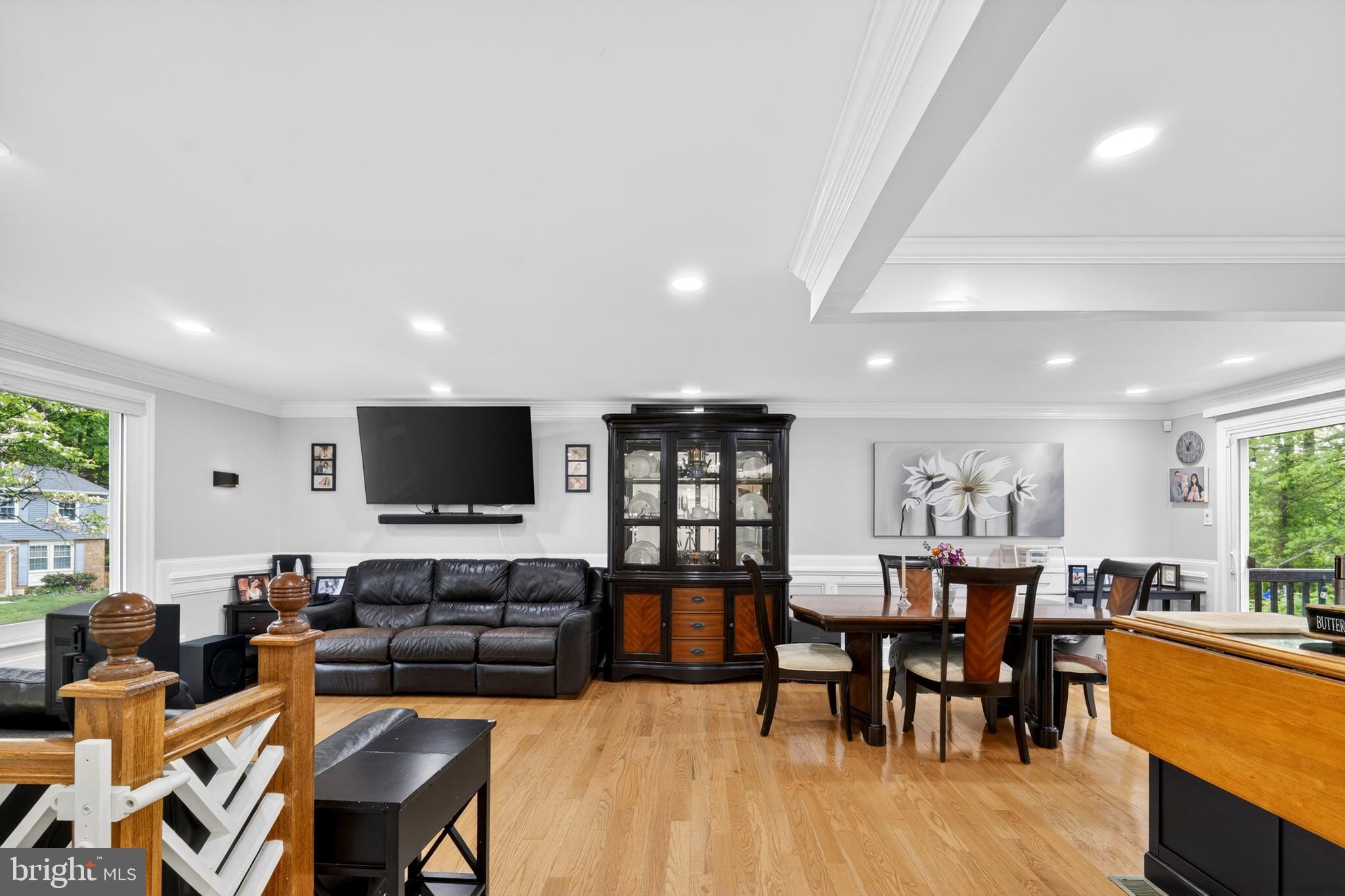 8373 Magic Leaf Road Springfield, VA 22153 - Photo 30 of 69 a living room with lots of furniture and a flat screen tv