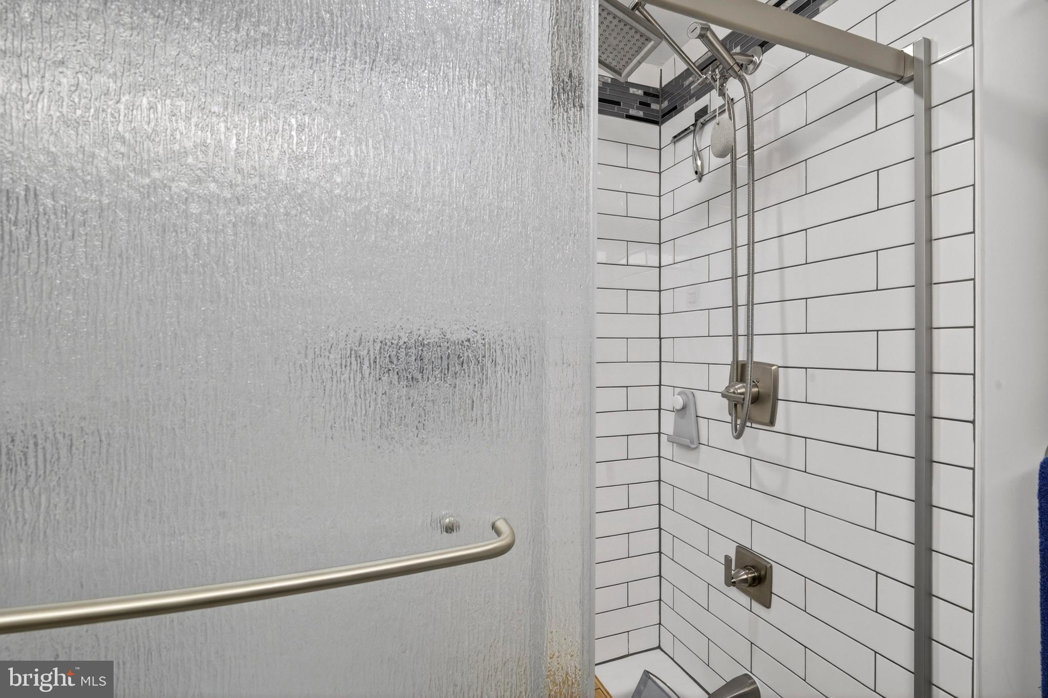 8373 Magic Leaf Road Springfield, VA 22153 - Photo 42 of 69 a bathroom with a shower