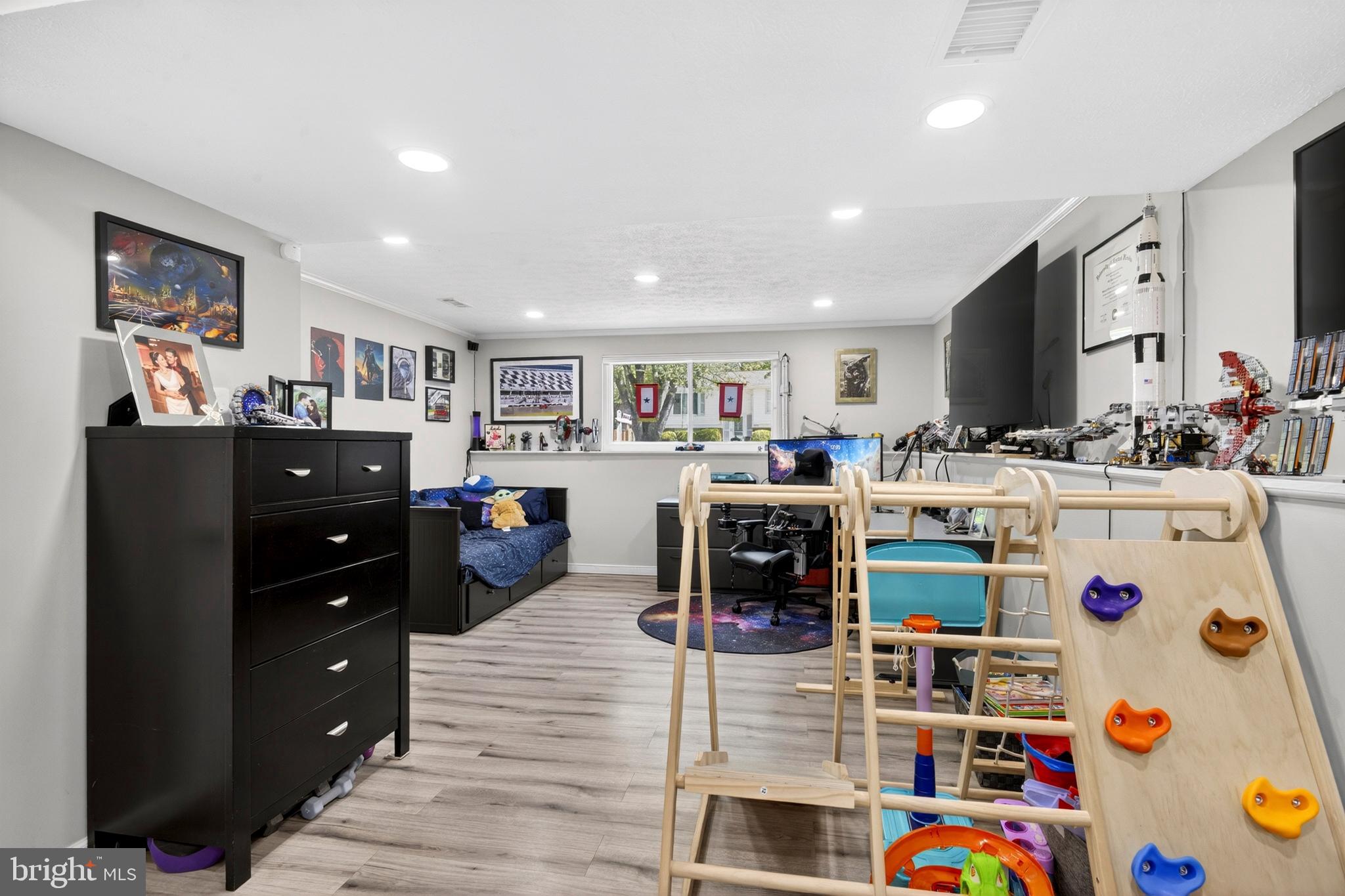 8373 Magic Leaf Road Springfield, VA 22153 - Photo 54 of 69 a room with lots of furniture and clutter