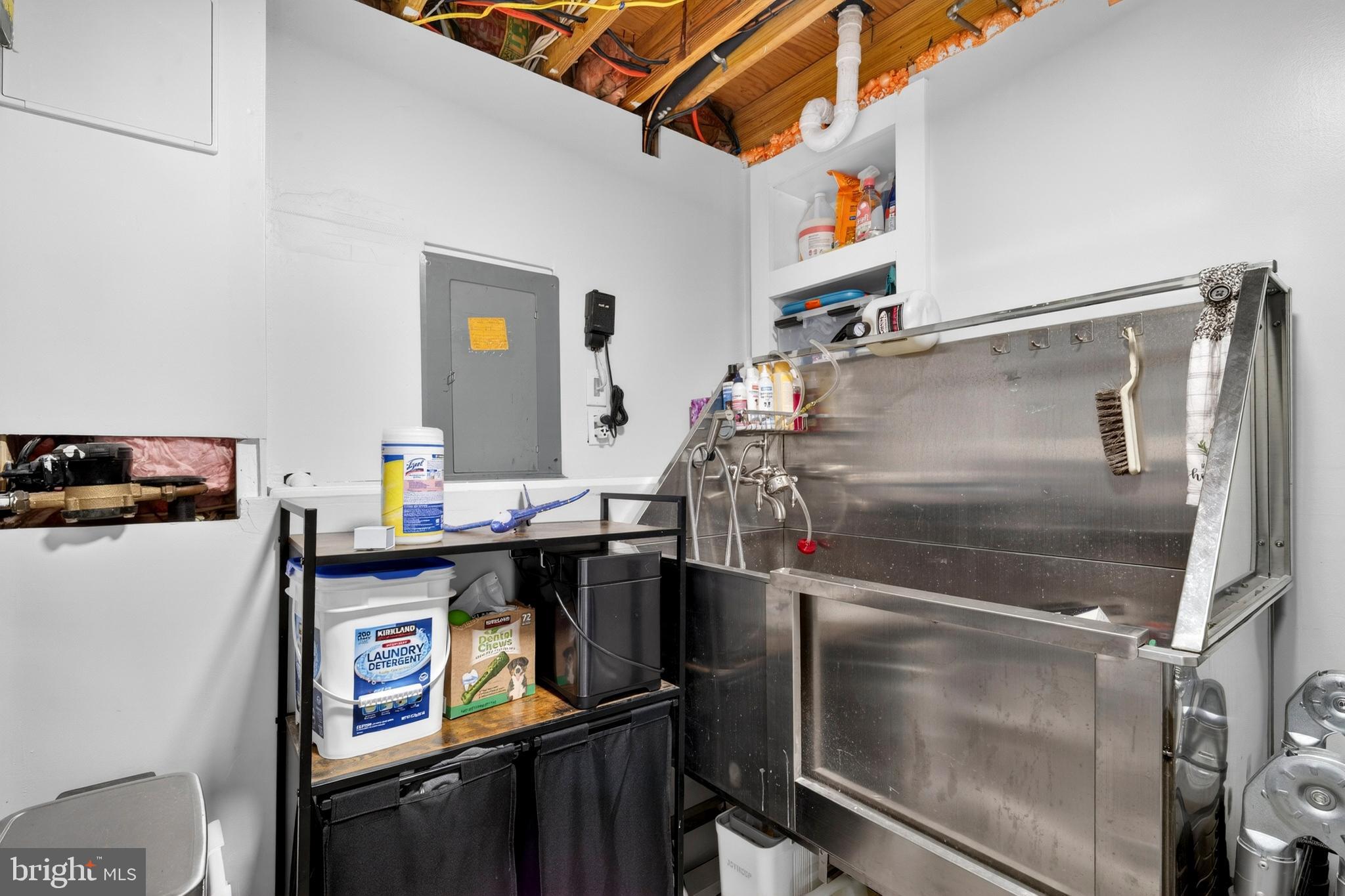8373 Magic Leaf Road Springfield, VA 22153 - Photo 56 of 69 a utility room with dryer and washer