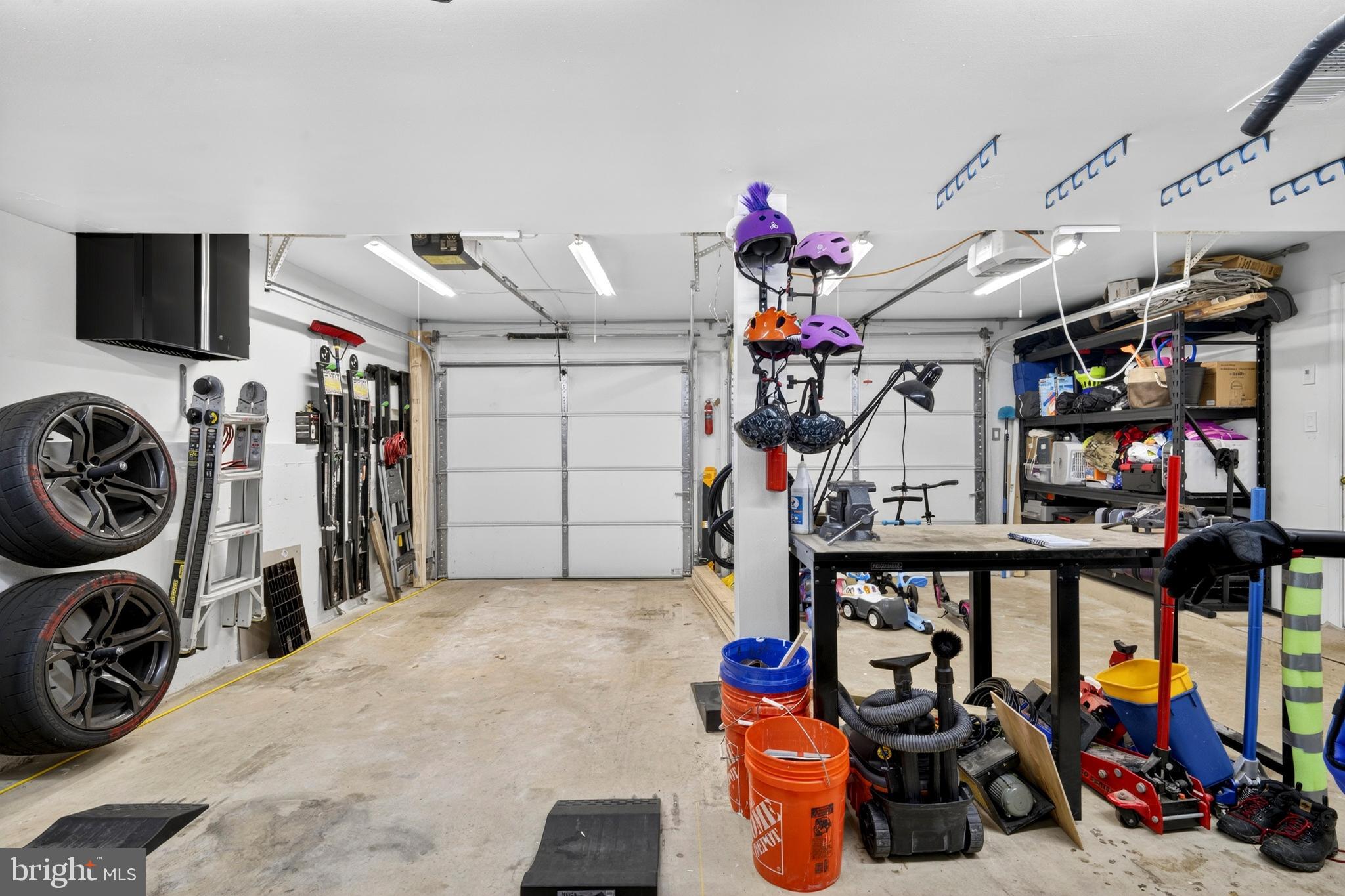 8373 Magic Leaf Road Springfield, VA 22153 - Photo 58 of 69 a view of a garage with a lot of stuff and toys