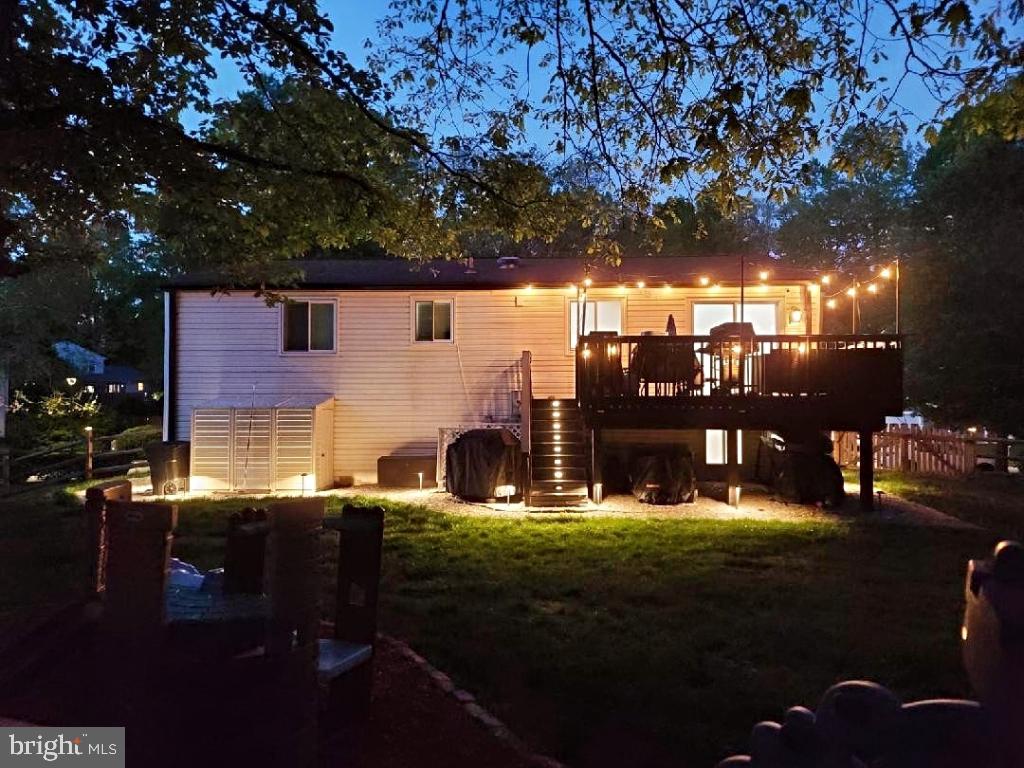 8373 Magic Leaf Road Springfield, VA 22153 - Photo 69 of 69 a backyard of a house with table and chairs
