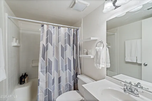 a bedroom with a bed and a closet