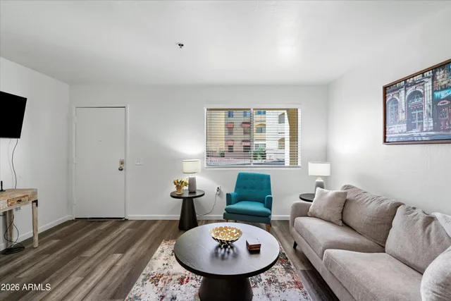 a living room with furniture and a table