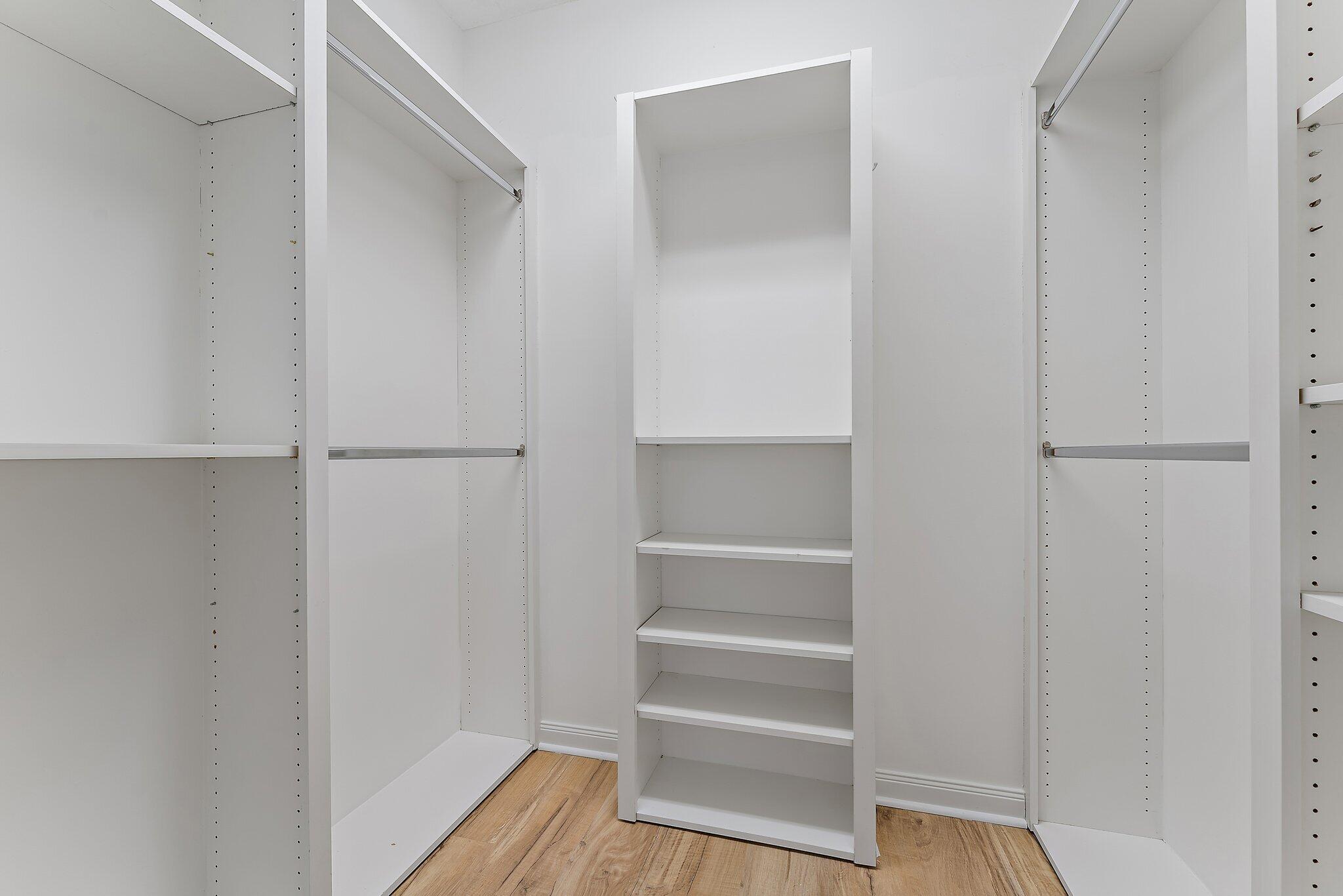 148 Middlebury Drive Jupiter, FL 33458 - Photo 21 of 32 a view of walk in closet with empty racks