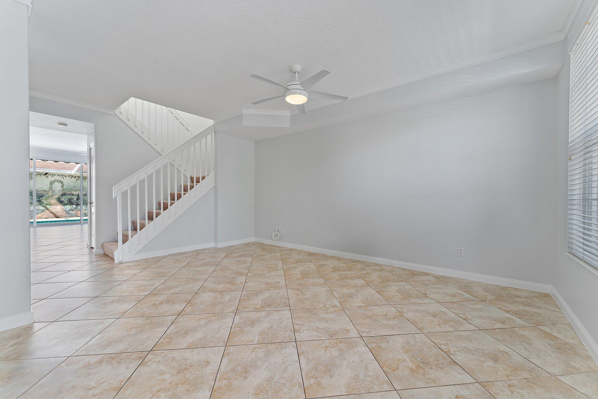 148 Middlebury Drive Jupiter, FL 33458 - Photo 5 of 32 a view of an empty room with staircase